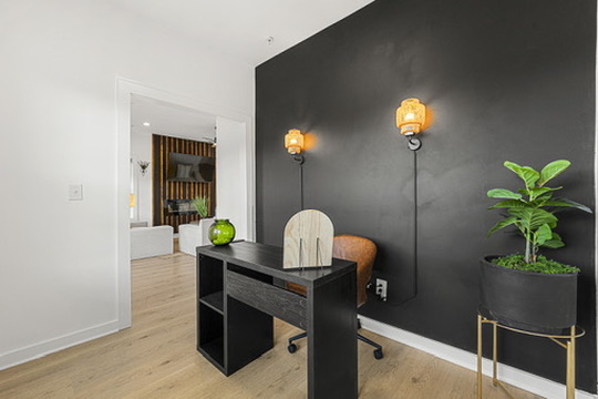 Above All Handyman home office remodel with black accent wall and modern lighting at 1498 Murphy Ave, Atlanta, GA.