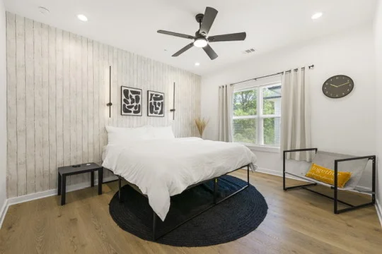 Handyman Atlanta | Reliable Home Repair & Improvement. 2 Local Handyman Atlanta – Murphy Ave bedroom renovation by Above All Handyman featuring modern wood accent wall, ceiling fan, and updated flooring.