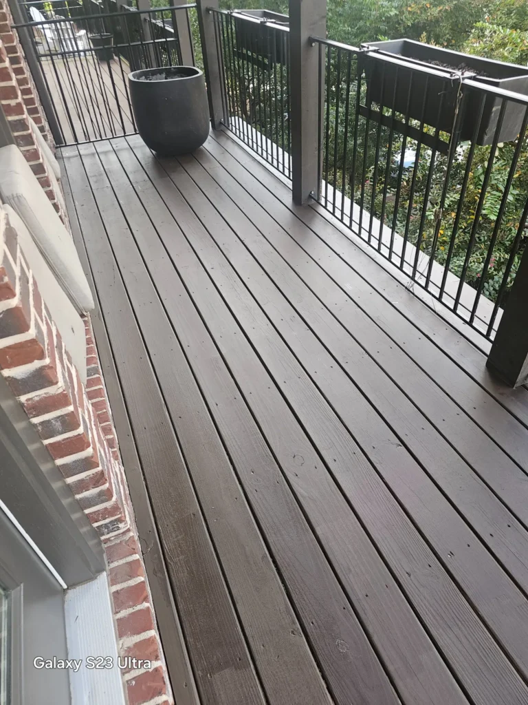 Deck Repair in Atlanta, GA | Above All Handyman 1 Beautifully restored deck at 348 Glen Iris Dr NE in Atlanta, GA after professional deck repair and staining by Above All Handyman.