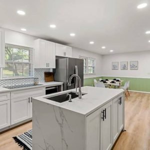 Kitchen Remodel Atlanta – Modern White Cabinetry & Marble Island | Above All Handyman Kitchen remodel at 2612 Clairmont Rd Atlanta featuring white shaker cabinets, marble island, stainless steel appliances, and modern LED lighting by Above All Handyman