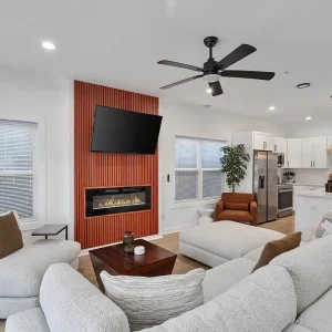 above-all-handyman-Local-Handyman-Atlanta-fireplace-kitchen-upgrade-1498-murphy-ave-atlanta-ga Modern living room remodel with fireplace feature wall built and designed by Our carpentry services Atlanta, ceiling fan, and open kitchen renovation by your local handyman Atlanta Above All Handyman in Atlanta, GA