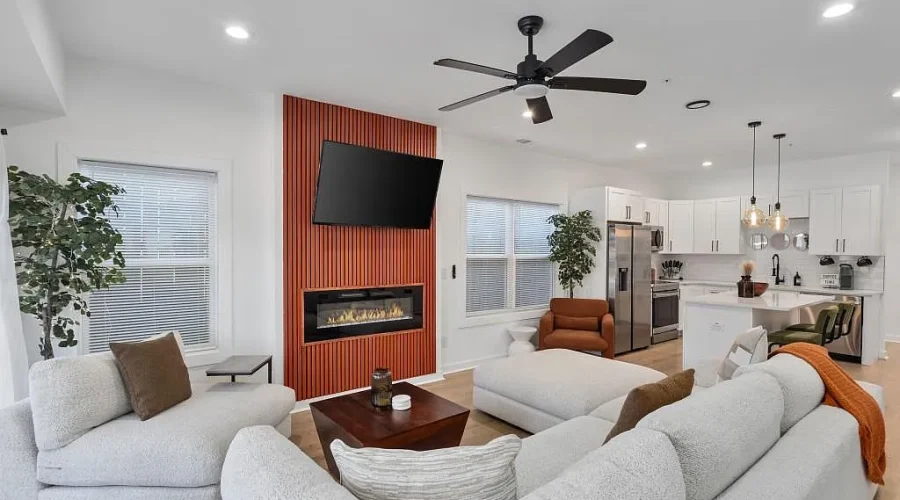 Above All Handyman living room remodel with modern fireplace and kitchen upgrade at 1498 Murphy Ave, Atlanta, GA.